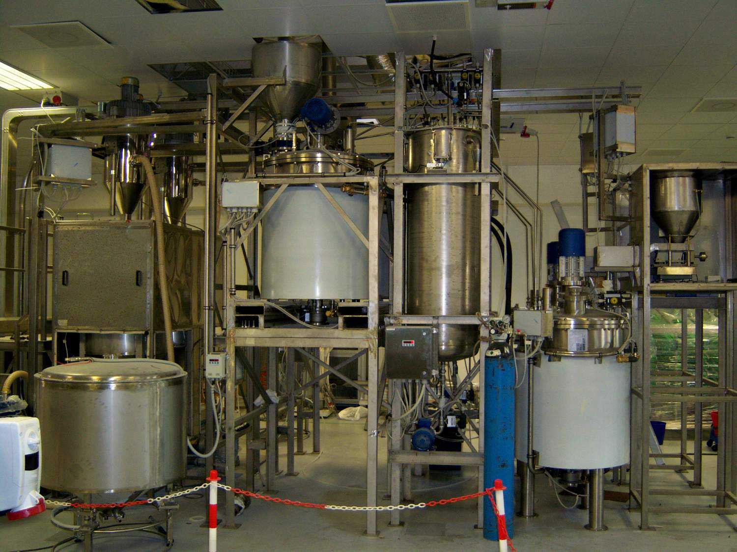 Integrated processing systems at a pharmaceutical manufacturing facility